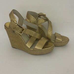 Michael kors shoes. It has a few spots you can see them in the photos. Pre-owned